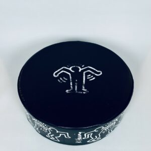 Keith HARING (1958-1990)  Pouf circulaire en mousse gainée de skaï noir orné d'un personnage stylisé blanc