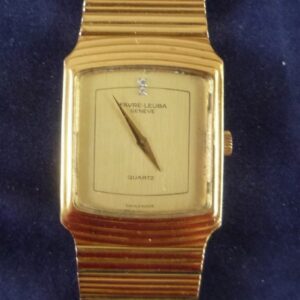 FAVRE-LEUBA -MONTRE-BRACELET pour homme en plaqué or. Cadran rectangulaire , fond champagne, rehaussée de deux brillants ,