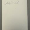 Andy WARHOL (1928-1987), Attribué à. Photographie argentique en noir et blanc, représentant Andy Warhol au déjeuner.   Signé au marqueur. Tampon de la signature « Andy Warhol » au dos de la photographie. Timbre sec en creux Andy Warhol. – Image 2