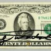 Andy WARHOL (1928-1987), Attribué à. Billet de 20 dollars Américain.   Signé « Andy Warhol » au marqueur et porte un dessin au marqueur.