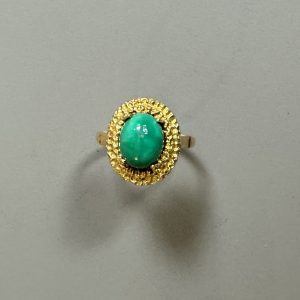 TRAVAIL ETRANGER - BAGUE en or 18k étranger serti d’une turquoise.